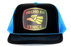 HECHO EN VENICE RASTA NEON TRUCKER HAT
